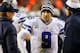 LANDOVER, MD - DECEMBER 30: Quarterback Tony Romo #9 taclks to Head coach Jason Garrett and Kyle Orton #18 of the Dallas Cowboys after they failed to convert on a third down against the Washington Redskins at FedExField on December 30, 2012 in Landover, Maryland. (Photo by Rob Carr/Getty Images)