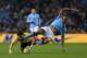MANCHESTER, ENGLAND - JANUARY 05: Fernando Forestieri of Watford is tackled by Vincent Kompany of Manchester City during the FA Cup with Budweiser Third Round match between Manchester City and Watford at The Etihad Stadium on January 5, 2013 in Manchester, England. (Photo by Richard Heathcote/Getty Images)