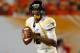 MIAMI GARDENS, FL - JANUARY 04: Geno Smith #12 of the West Virginia Mountaineers looks to pass against the Clemson Tigers during the Discover Orange Bowl at Sun Life Stadium on January 4, 2012 in Miami Gardens, Florida. (Photo by Streeter Lecka/Getty Images)