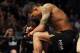 Jan 26, 2013; Chicago, IL, USA; Anthony Pettis kneels before his fight against Donald Cerrone (not pictured) during UFC on FOX 6 at the United Center. Mandatory Credit: David Banks-USA TODAY Sports