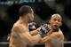 Jan 26, 2013; Chicago, IL, USA; Demetrious Johnson (black shorts) fights John Dodson (white shorts) during UFC on FOX 6 for the world flyweight championship at the United Center. Mandatory Credit: David Banks-USA TODAY Sports