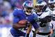 EAST RUTHERFORD, NJ - DECEMBER 30: David Wilson #22 of the New York Giants carries the ball as Kurt Coleman #42 of the Philadelphia Eagles defends at MetLife Stadium on December 30, 2012 in East Rutherford, New Jersey. The New York Giants defeated the Philadelphia Eagles 42-7. (Photo by Elsa/Getty Images)
