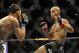 Jan 26, 2013; Chicago, IL, USA; Demetrious Johnson (black shorts) fights John Dodson (white shorts) during UFC on FOX 6 for the world flyweight championship at the United Center. Mandatory Credit: David Banks-USA TODAY Sports