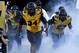 COLUMBIA , MO - SEPTEMBER 8: Sheldon Richardson #34 of the Missouri Tigers leads his team onto the field before their game against the Georgia Bulldogs at Memorial Stadium on September 8, 2012 in Columbia, Missouri. (Photo by Ed Zurga/Getty Images)
