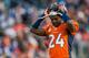 DENVER, CO - DECEMBER 23: Cornerback Champ Bailey #24 of the Denver Broncos replaces his helmet after a timeout during a game against the Cleveland Browns at Sports Authority Field at Mile High on December 23, 2012 in Denver, Colorado. The Broncos defeated the Browns 34-12. (Photo by Dustin Bradford/Getty Images)