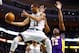 BOSTON, MA - FEBRUARY 7: Courtney Lee #11 of the Boston Celtics goes midair underneath the basket for a pass in front of Dwight Howard #12 of the Los Angeles Lakers during the game on February 7, 2013 at TD Garden in Boston, Massachusetts. NOTE TO USER: User expressly acknowledges and agrees that, by downloading and or using this photograph, User is consenting to the terms and conditions of the Getty Images License Agreement. (Photo by Jared Wickerham/Getty Images)