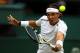 LONDON, ENGLAND - JUNE 26: Rafael Nadal of Spain hits a backhand return during his his Gentlemen's Singles first round match against Thomaz Bellucci of Brazil on day two of the Wimbledon Lawn Tennis Championships at the All England Lawn Tennis and Croquet Club on June 26, 2012 in London, England. (Photo by Clive Brunskill/Getty Images)