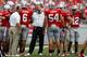 COLUMBUS, OH - SEPTEMBER 1: Head Coach Urban Meyer of the Ohio State Buckeyes watches a reply while meeting with members of his defense during a timeout on September 1, 2012 at Ohio Stadium in Columbus, Ohio. Ohio State defeated Miami 56-10. (Photo by Kirk Irwin/Getty Images)