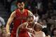 CHICAGO, IL - MARCH 24: Andrea Bargnani #7 of the Toronto Raptors grabs the arm of Carlos Boozer #5 of the Chicago Bulls as Boozer tries to control the ball at the United Center on March 24, 2012 in Chicago, Illinois. NOTE TO USER: User expressly acknowledges and agrees that, by downloading and or using this photograph, User is consenting to the terms and conditions of the Getty Images License Agreement. (Photo by Jonathan Daniel/Getty Images)