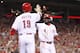CINCINNATI, OH - JULY 15: Brandon Phillips #4 and Joey Votto #19 of the Cincinnati Reds celebrate after both scored runs in the eighth inning after a single by Scott Rolen (not pictured) during the game against the St. Louis Cardinals at Great American Ball Park on July 15, 2012 in Cincinnati, Ohio. The Reds won 4-2. (Photo by Joe Robbins/Getty Images)