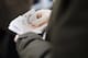NEWBURY, ENGLAND - DECEMBER 15: A punter gets his money ready for a wager at Newbury racecourse on December 15, 2010 in Newbury, England. (Photo by Alan Crowhurst/ Getty Images)