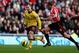 SUNDERLAND, ENGLAND - FEBRUARY 09: Jack Wilshere of Arsenal moves away from Lee Cattermole of Sunderland during the Barclays Premier League match between Sunderland and Arsenal at the Stadium of Light on February 9, 2013 in Sunderland, England. (Photo by Clive Brunskill/Getty Images)