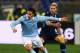 ROME, ITALY - FEBRUARY 09: Sergio Floccari (L) of S.S. Lazio competes for the ball with Valon Behrami of SSC Napoli during the Serie A match between S.S. Lazio and SSC Napoli at Stadio Olimpico on February 9, 2013 in Rome, Italy. (Photo by Paolo Bruno/Getty Images)