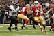 Feb 3, 2013; New Orleans, LA, USA; San Francisco 49ers quarterback Colin Kaepernick (7) looks to throw as he is chased by Baltimore Ravens outside linebacker Terrell Suggs (55) during the first quarter in Super Bowl XLVII at the Mercedes-Benz Superdome. Mandatory Credit: Matthew Emmons-USA TODAY Sports