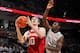 COLUMBUS, OH - FEBRUARY 10: Cody Zeller #40 of the Indiana Hoosiers drives to the hoop to lay in the ball past the defense of Shannon Scott #3 of the Ohio State Buckeyes in the first half on February 10, 2013 at Value City Arena in Columbus, Ohio. (Photo by Jamie Sabau/Getty Images)