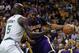 Feb 7, 2013; Boston, Massachusetts, USA; Los Angeles Lakers center Dwight Howard (12) is guarded by Boston Celtics forward/center Kevin Garnett (5) during the first quarter at TD Banknorth Garden. Mandatory Credit: Greg M. Cooper-USA TODAY Sports