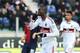 CAGLIARI, ITALY - FEBRUARY 10: Mario Balotelli of AC Milan celebrates his goal scored from the penalty spot during the Serie A match between Cagliari Calcio and AC Milan at Stadio Is Arenas on February 10, 2013 in Cagliari, Italy. (Photo by Valerio Pennicino/Getty Images)