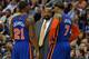 PHILADELPHIA, PA - MARCH 21: Head coach Mike Woodson of the New York Knicks talk with Iman Shumpert #21 and Carmelo Anthony #7 during the game against the Philadelphia 76ers at the Wells Fargo Center on March 21, 2012 in Philadelphia, Pennsylvania. The Knicks won 82-79. NOTE TO USER: User expressly acknowledges and agrees that, by downloading and or using this photograph, User is consenting to the terms and conditions of the Getty Images License Agreement. (Photo by Drew Hallowell/Getty Images)