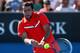 MELBOURNE, AUSTRALIA - JANUARY 15: Marin Cilic of Croatia plays a backhand in his first round match against Marinko Matosevic of Australia during day two of the 2013 Australian Open at Melbourne Park on January 15, 2013 in Melbourne, Australia. (Photo by Chris Hyde/Getty Images)