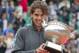 June 11, 2012; Paris, FRANCE; Rafael Nadal (ESP) poses with the winner's trophy after the men's singles finals of the 2012 French Open against Novak Djokovic (SRB) at Roland Garros. Nadal won 6-4, 6-3, 2-6, 7-5. Mandatory Credit: Susan Mullane-USA TODAY Sports