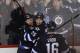 WINNIPEG, MB - FEBRUARY 5: Bryan Little #18 of the Winnipeg Jets and teammate Zach Redmond #25 celebrate Little's overtime goal to defeat the Florida Panthers 3-2 in NHL action on February 5, 2013 at the MTS Centre in Winnipeg, Manitoba, Canada. (Photo by Marianne Helm/Getty Images)