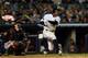 NEW YORK, NY - OCTOBER 12: Curtis Granderson #14 of the New York Yankees hits a solo home run in the seventh inning against the Baltimore Orioles during Game Five of the American League Division Series at Yankee Stadium on October 12, 2012 in New York, New York. (Photo by Elsa/Getty Images)
