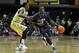 NASHVILLE, TN - DECEMBER 01: JayVaughn Pinkston #22 of the Villanova Wildcats dribbles past James Siakam #35 of the Vanderbilt Commodores at Memorial Gym on December 1, 2012 in Nashville, Tennessee. (Photo by Frederick Breedon/Getty Images)
