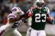 EAST RUTHERFORD, NJ - NOVEMBER 27: Shonn Greene #23 of the New York Jets rund with the ball as Nick Barnett #50 of the Buffalo Bills defends during their game on November 27, 2011 at MetLife Stadium in East Rutherford, New Jersey. (Photo by Al Bello/Getty Images)