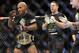 Jan 26, 2013; Chicago, IL, USA; Demetrious Johnson (left) celebrates after defeating John Dodson (not pictured) during UFC on FOX 6 for the world flyweight championship at the United Center. Mandatory Credit: David Banks-USA TODAY Sports