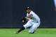 ATLANTA, GA - AUGUST 13: Michael Bourn #24 of the Atlanta Braves makes a sliding catch against the San Diego Padres at Turner Field on August 13, 2012 in Atlanta, Georgia. (Photo by Scott Cunningham/Getty Images)