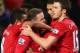 MANCHESTER, ENGLAND - JANUARY 30: Wayne Rooney of Manchester United celebrates with team mates as he scores their second goal during the Barclays Premier League match between Manchester United and Southampton at Old Trafford on January 30, 2013 in Manchester, England. (Photo by Alex Livesey/Getty Images)