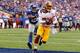 EAST RUTHERFORD, NJ - OCTOBER 21: Santana Moss #89 of the Washington Redskins scores a touchdown in the fourth quarter against Jayron Hosley #28 of the New York Giants during their game at MetLife Stadium on October 21, 2012 in East Rutherford, New Jersey. (Photo by Al Bello/Getty Images)