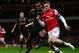 LONDON, ENGLAND - JANUARY 30: Aaron Ramsey of Arsenal and Andre Wisdom of Liverpool compete for the ball during the Barclays Premier League match between Arsenal and Liverpool at Emirates Stadium on January 30, 2013 in London, England. (Photo by Laurence Griffiths/Getty Images)