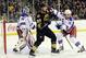 February 12, 2013; Boston, MA USA; Boston Bruins center Patrice Bergeron (37) tries to screen New York Rangers goalie Henrik Lundqvist (30) while Rangers defenseman Marc Staal (18) defends during the second period at TD Garden. Mandatory Credit: Bob DeChiara-USA TODAY Sports