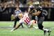 NEW ORLEANS, LA - NOVEMBER 25: Kyle Williams #10 of the San Francisco 49ers is knocked down by Jonathan Vilma #51 of the New Orleans Saints during a game at the Mercedes-Benz Superdome on November 25, 2012 in New Orleans, Louisiana. (Photo by Stacy Revere/Getty Images)