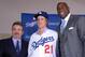 Dec 11, 2012; Los Angeles, CA, USA; Zack Greinke (center) poses with Los Angeles Dodgers general manager Ned Colletti (left) and co-owner Magic Johnson at press conference to announce Greinke's signing as a free agent pitcher at Dodger Stadium. Mandatory Credit: Kirby Lee/Image of Sport-USA TODAY Sports