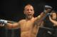 Jan 12, 2013; Oklahoma City, OK, USA; Tarec Saffiedine (red and black shorts) celebrates after his match with Nate Marquardt (not shown) in their Strikeforce MMA Welterweight Title bout at the Chesapeake Energy Arena. Mandatory Credit: Mark D. Smith-USA TODAY Sports