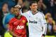 MADRID, SPAIN - FEBRUARY 13: Patrice Evra of Manchester United and Cristiano Ronaldo of Real Madrid at the final whistle during the UEFA Champions League Round of 16 first leg match between Real Madrid and Manchester United at Estadio Santiago Bernabeu on February 13, 2013 in Madrid, Spain. (Photo by Mike Hewitt/Getty Images)