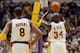 LOS ANGELES - NOVEMBER 30: Kobe Bryant #8 of the Los Angeles Lakers watches teammate Shaquille O'Neal #34 shoot a free throw during the game against the Indiana Pacers at Staples Center on November 30, 2003 in Los Angeles, California. The Lakers won 99-77. NOTE TO USER: User expressly acknowledges and agrees that, by downloading and/or using this Photograph, User is consenting to the terms and conditions of the Getty Images License Agreement. (Photo by Lisa Blumenfeld/Getty Images)