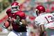 FAYETTEVILLE, AR - APRIL 21: Chris Gragg #80 of the Arkansas Razorbacks Red Team prepares to stiff arm Davyon McKinney #13 of the White Team during the Spring Game at Donald W. Reynolds Stadium on April 21, 2012 in Fayetteville, Arkansas. (Photo by Wesley Hitt/Getty Images)