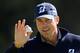 PACIFIC PALISADES, CA - FEBRUARY 14: Matt Kuchar reacts to his putt on the 13th hole to finish seven under par for the day during the first round of the Northern Trust Open at the Riviera Country Club on February 14, 2013 in Pacific Palisades, California. (Photo by Harry How/Getty Images)