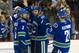 VANCOUVER, CANADA - FEBRUARY 12: Kevin Bieksa #3 of the Vancouver Canucks is congratulated by Dan Hamhuis #2, Zack Kassian #9 and Mason Raymond #21 after scoring against the Minnesota Wild during the first period in NHL action on February 12, 2013 at Rogers Arena in Vancouver, British Columbia, Canada. (Photo by Rich Lam/Getty Images)