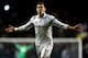 LONDON, ENGLAND - FEBRUARY 14: Gareth Bale of Spurs celebrates after scoring his team's match winning second goal from a free kick during the UEFA Europa League round of 32 first leg match between Tottenham Hotspur and Olympique Lyonnais at White Hart Lane on February 14, 2013 in London, England. (Photo by Paul Gilham/Getty Images)