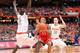 SYRACUSE, NY - FEBRUARY 10: D'Angelo Harrison #11 of the St. John's Red Storm drives to the basket against Baye Moussa Keita #12 and Trevor Cooney #10 of the Syracuse Orange during the game at the Carrier Dome on February 10, 2013 in Syracuse, New York. (Photo by Nate Shron/Getty Images)