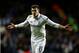 LONDON, ENGLAND - FEBRUARY 14: Gareth Bale of Spurs celebrates after scoring his team's match winning second goal from a free kick during the UEFA Europa League round of 32 first leg match between Tottenham Hotspur and Olympique Lyonnais at White Hart Lane on February 14, 2013 in London, England. (Photo by Paul Gilham/Getty Images)