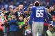 EAST RUTHERFORD, NJ - DECEMBER 30: Will Beatty #65 of the New York Giants greets families of Sandy Hook Elementary School before the game against the Philadelphia Eagles their game against the at MetLife Stadium on December 30, 2012 in East Rutherford, New Jersey. (Photo by Al Bello/Getty Images)