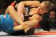 August 18, 2012; San Diego, CA, USA; Sarah Kaufman (blue shirt) and Ronda Rousey (black shirt) during their Strikeforce MMA women's bantamweight title bout at the Valley View Casino Center. Rousey won in 54 seconds of the first round. Mandatory Credit: Jayne Kamin-Oncea-USA TODAY Sports