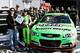 DAYTONA BEACH, FL - FEBRUARY 17: Danica Patrick, driver of the #10 GoDaddy.com Chevrolet, celebrates with Kris Redlinger of GoDaddy.com after winning the pole award for the NASCAR Sprint Cup Series Daytona 500 at Daytona International Speedway on February 17, 2013 in Daytona Beach, Florida. (Photo by Jerry Markland/Getty Images)