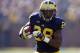 ANN ARBOR, MI - NOVEMBER 17: Fitzgerald Toussaint #28 of the Michigan Wolverines looks for running room during a first quarter run while playing the Iowa Hawkeyes at Michigan Stadium on November 17, 2012 in Ann Arbor, Michigan. Toussaint was seriously injured at the end of the play and needed to be taken off the field by paramedics. Michigan won the game 42-17. (Photo by Gregory Shamus/Getty Images)