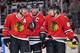 Feb 12, 2013; Chicago, IL, USA; Chicago Blackhawks defenseman Duncan Keith (left) and center Jonathan Toews (middle) and right wing Patrick Kane (right) talk during the overtime period against the Anaheim Ducks at the United Center. The Ducks beat the Blackhawks 3-2 in the shootout. Mandatory Credit: Rob Grabowski-USA TODAY Sports